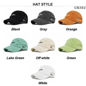 Flat lay display of vintage washed cotton baseball caps with distressed holes in 7 colors