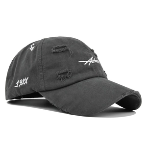 Detail of distressed charcoal baseball cap featuring Asher white embroidery and torn brim