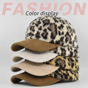 Vertical stack of leopard print lamb wool baseball caps showing corduroy brim details