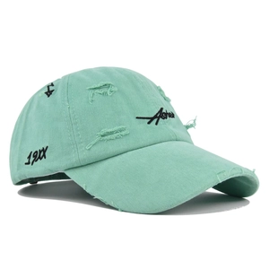 Detail of mint green distressed baseball cap with vintage Asher embroidery and worn edges