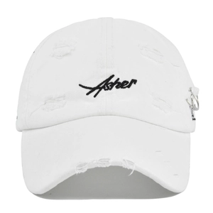 Close-up of Asher embroidery and metal rings on distressed white baseball cap