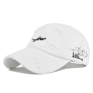 Detail of distressed white baseball cap with After embroidery and metal ring accents