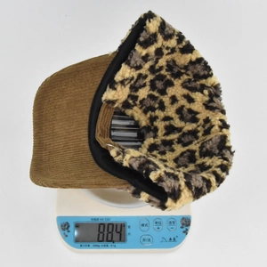Detailed view of lightweight brown corduroy baseball cap weighing 88.4g on a scale