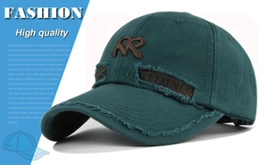 Detail of distressed dark green baseball cap with brown RR embroidery and side patch