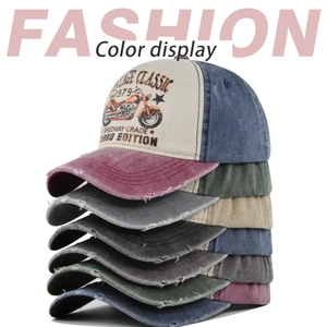 Pile of vintage washed baseball caps showing multiple distressed color options and prints