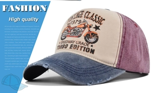 Detail of distressed brim and retro motorcycle print on a vintage trucker hat