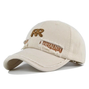 Detailed macro view of distressed off-white canvas baseball cap with RR embroidery