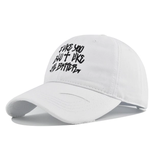 Detailed view of white cotton baseball cap with black cross and text embroidery design