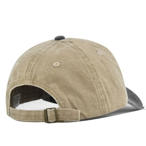 Detail of vintage washed cotton baseball cap with adjustable metal buckle and contrast brim
