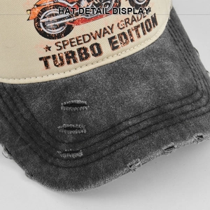 Detail of distressed brim and vintage motorcycle print on washed canvas baseball cap