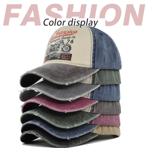 Stacked vintage trucker hats with distressed edges and San Francisco motorcycle prints