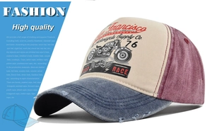 Macro detail of vintage distressed denim brim and retro motorcycle graphic on trucker cap