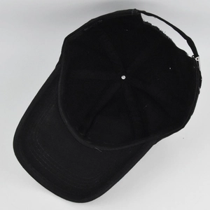 Detail view showing internal structure and adjustable strap of black cotton baseball cap