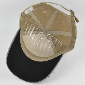Detail of vintage cotton baseball cap interior with mesh support and adjustable strap