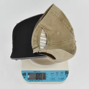 Weight measurement of a washed vintage canvas baseball cap with metal buckle on scale