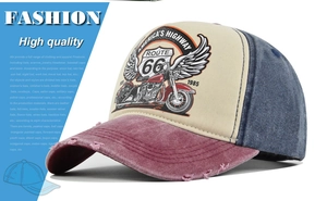 Close-up of distressed brim and vintage Route 66 print on washed cotton baseball cap