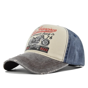 Macro detail of distressed brim and vintage motorcycle print on trucker cap