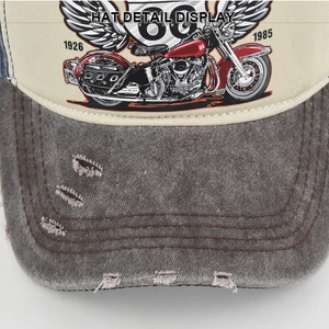 Close-up of vintage Route 66 baseball cap with distressed brim and motor print