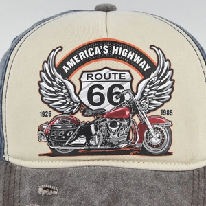 Close-up of vintage Route 66 baseball cap with motorcycle print and distressed brim