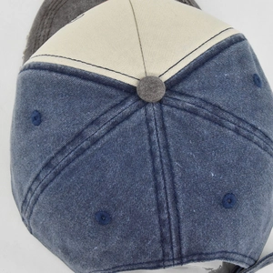 Detailed top view of vintage denim baseball cap showing stitched eyelets and fabric texture