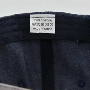 Detail view of 100% cotton wash label and fabric texture on vintage baseball cap