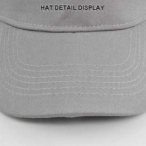 Macro detail of high-quality stitching on light grey cotton twill baseball cap brim