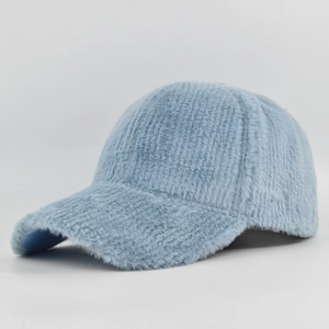Detailed close-up of light blue faux fur baseball cap showing soft plush texture and curved brim