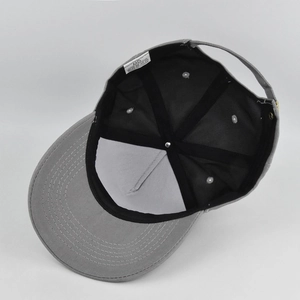 Internal view of the dark grey cotton baseball cap with reinforced seams and care label