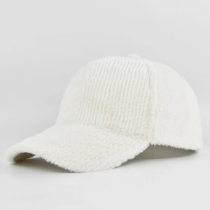 Side view of a white fuzzy faux fur baseball cap with a curved brim for autumn winter