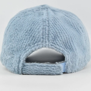 Close-up of light blue faux fur baseball cap back with adjustable strap and ribbed texture