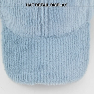 Detail shot of light blue faux fur baseball hat showing soft plush texture and stitching