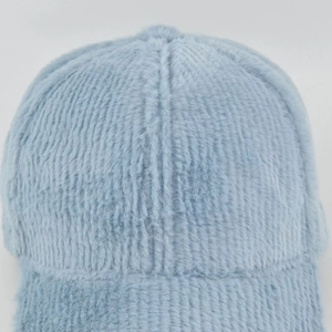 Macro shot of light blue faux fur texture with vertical stripes on baseball cap top