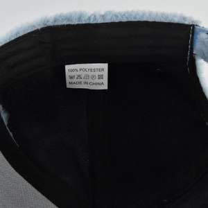 Detail view of the soft faux fur baseball cap showing the interior polyester lining and label