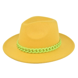 Detail of yellow wool fedora hat with a bold neon green chain strap decoration