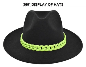 Detail of black wool fedora with vibrant neon green chain accessory and wide flat brim