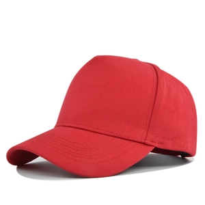 Detailed side view of solid red cotton twill 5-panel baseball cap with curved visor