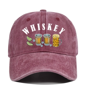 Detailed close-up of vintage washed burgundy baseball cap featuring whiskey graphic print