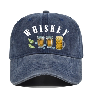 Detail of washed navy denim baseball cap with Whiskey text and beverage illustrations