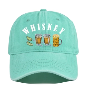 Detail of mint green washed baseball cap with whiskey and beer graphic embroidery