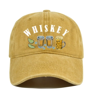 Close-up of vintage mustard yellow washed cotton baseball cap with whiskey graphic