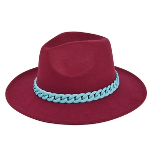 Detail of burgundy fedora hat with a contrasting light blue plastic chain decoration