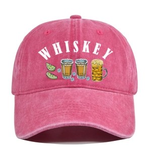 Detailed close-up of pink washed cotton baseball cap with white Whiskey print and embroidery