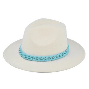 Detail shot of the white wide brim fedora hat featuring a light blue plastic chain decoration