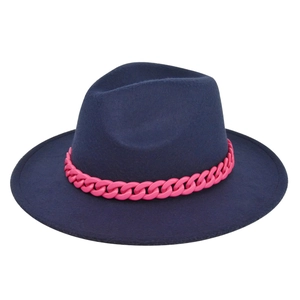 Detail of navy wool fedora hat featuring a chunky vibrant pink chain decorative band