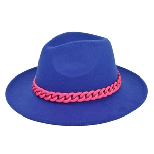 Close-up of royal blue wool fedora hat with stylish pink chain link decoration