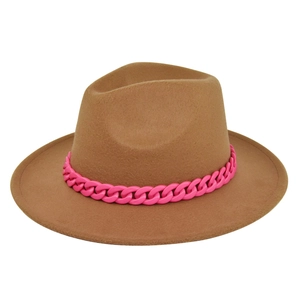 Detail of camel fedora hat featuring a bold pink plastic chain accent on a flat brim