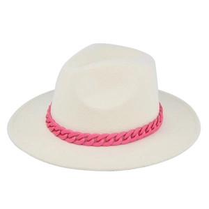 Detailed view of cream fedora hat featuring a bold pink plastic chain accessory