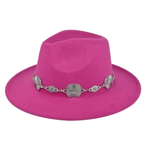 Detail of silver daisy chain decoration on the brim of a fuchsia fedora hat