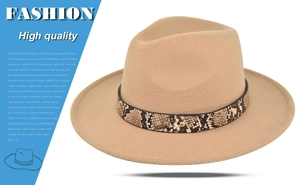 Detail of camel fedora hat featuring a stylish snakeskin band and gold metal buckle accent
