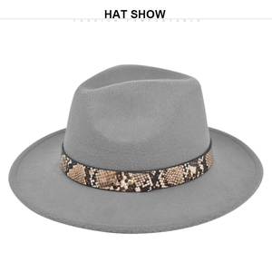 Close-up of grey wool fedora hat featuring a snakeskin leather band and gold buckle